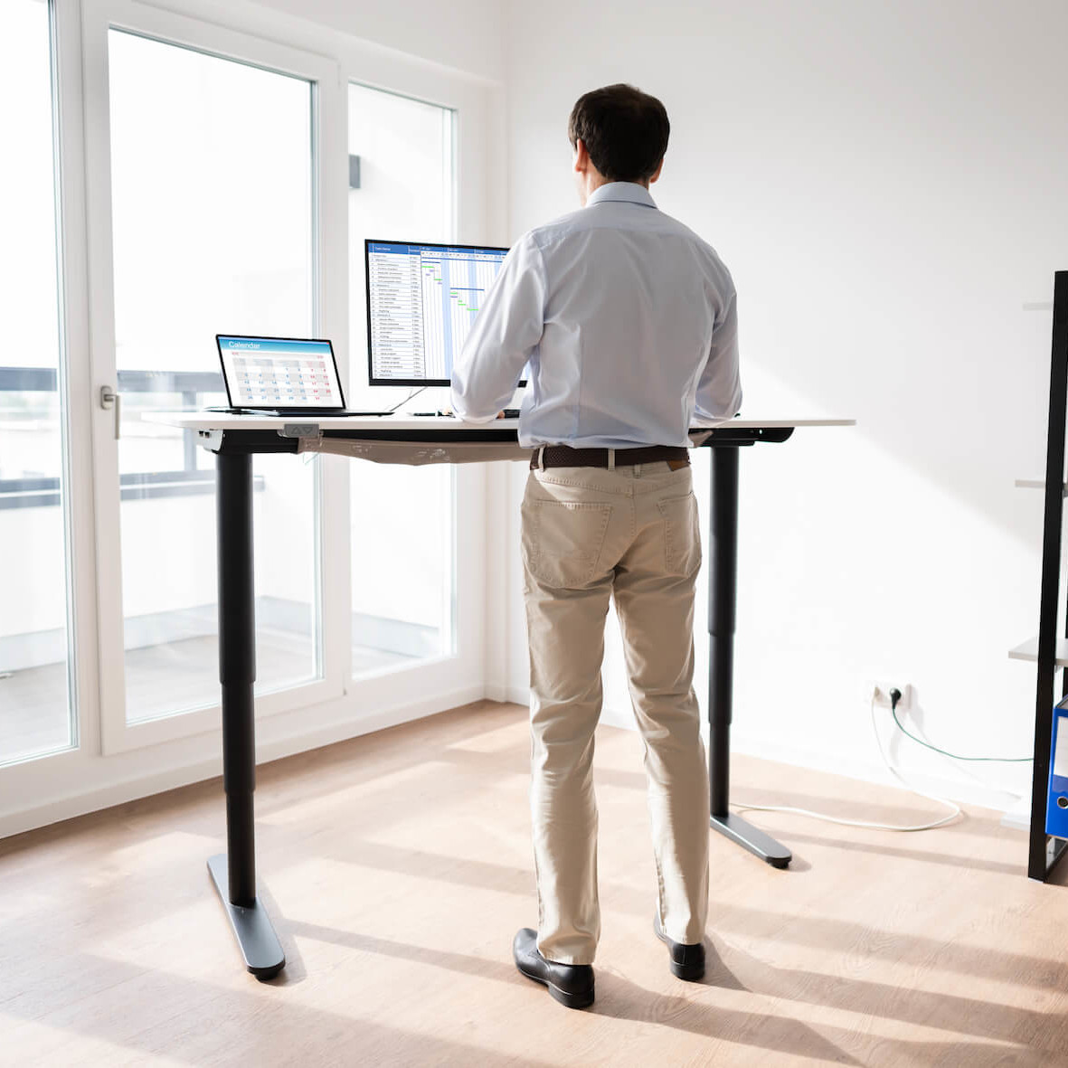 Physiotherapy advice about good posture at work using a standing desk